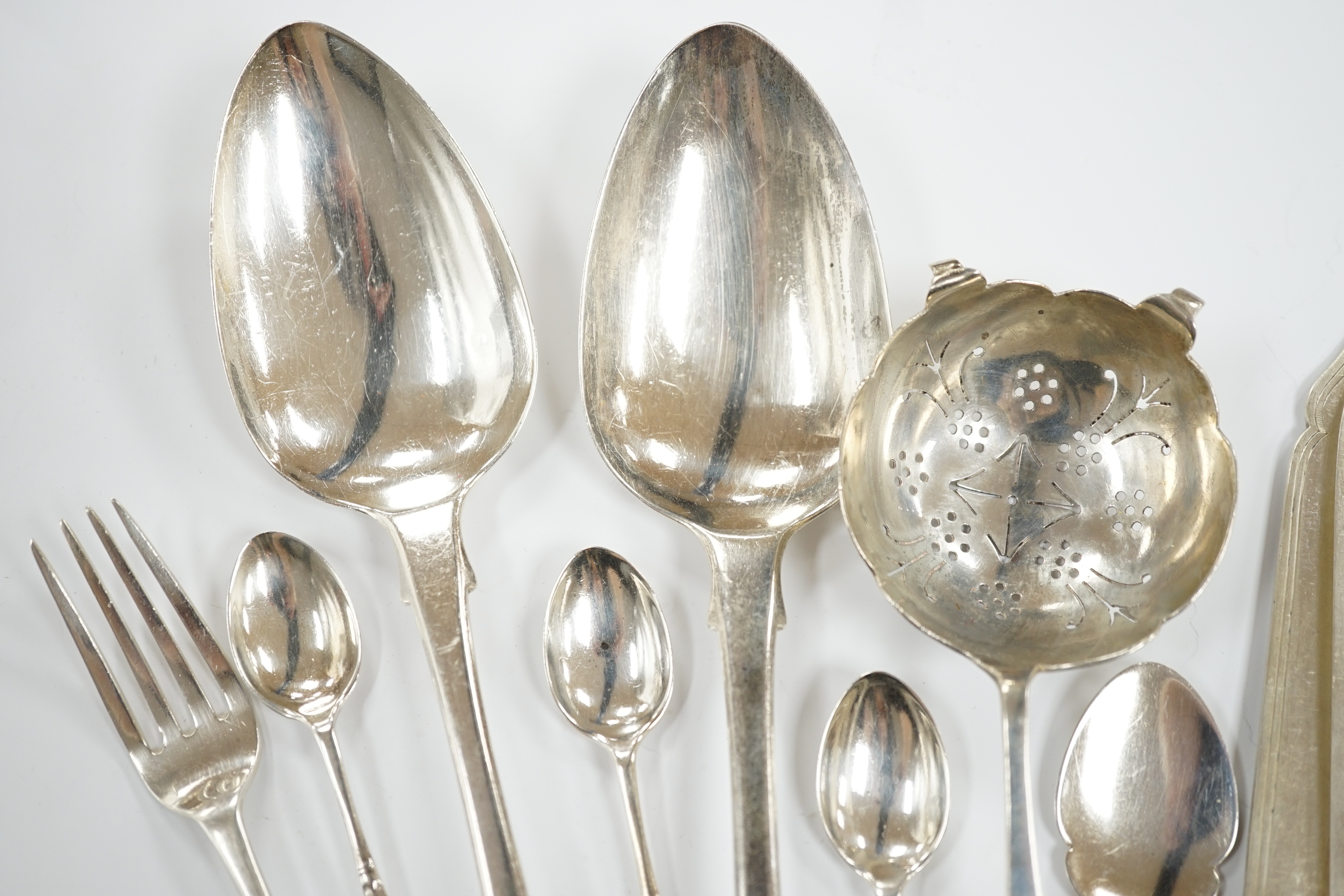 A pair of George IV silver fiddle pattern table spoons, William Bateman, London, 1824, six other later silver items of flatware, 7.5oz, together with six silver knife blades and five set of silver fork tines, gross 11.8o